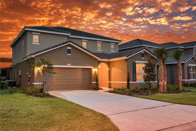 5231 Wildwood Way, Davenport, FL 33837 - traditional home featuring stucco siding, a front lawn, and concrete driveway