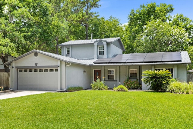878 Elgin Dr, Winter Springs, FL 32708 - view of front facade featuring stucco siding, a garage, roof mounted solar panels, and concrete driveway