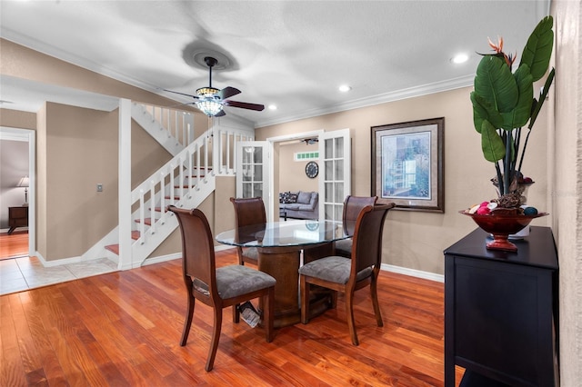 878 Elgin Dr, Winter Springs, FL 32708 - dining room featuring ornamental molding, stairs, light wood-style floors, ceiling fan, and recessed lighting