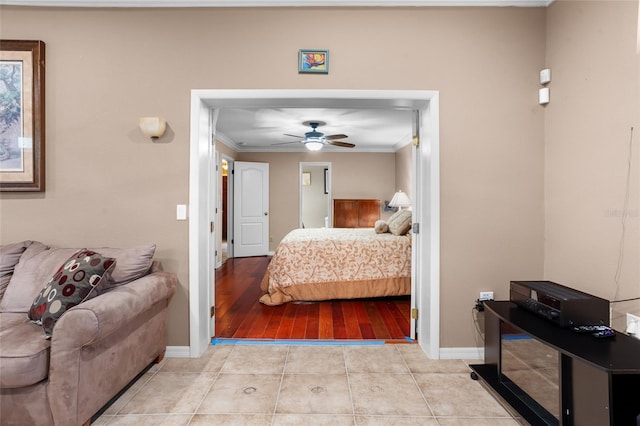 878 Elgin Dr, Winter Springs, FL 32708 - bedroom featuring ornamental molding, tile patterned flooring, and a ceiling fan