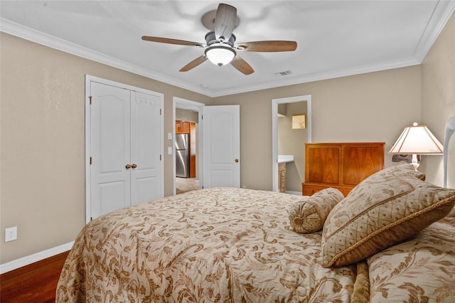 878 Elgin Dr, Winter Springs, FL 32708 - bedroom featuring freestanding refrigerator, a closet, crown molding, wood finished floors, and a ceiling fan