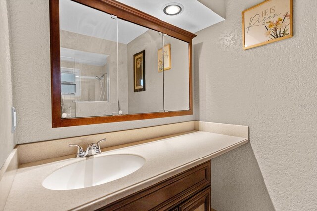 878 Elgin Dr, Winter Springs, FL 32708 - full bathroom featuring a textured wall, vanity, and a shower