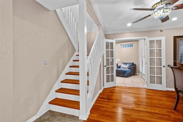 878 Elgin Dr, Winter Springs, FL 32708 - staircase with french doors, crown molding, a ceiling fan, wood-type flooring, and recessed lighting