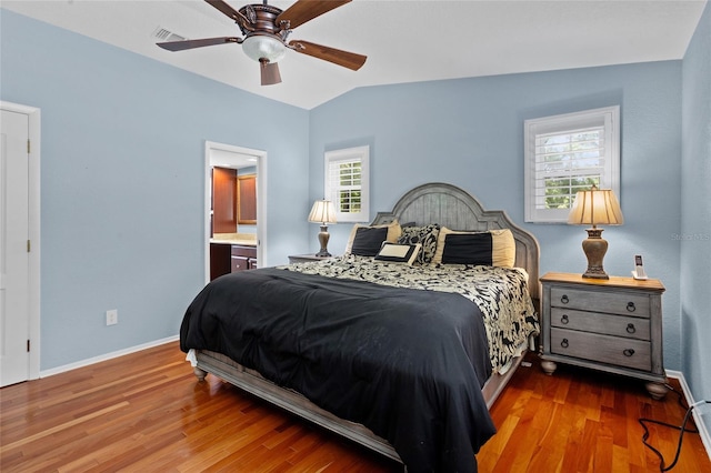 878 Elgin Dr, Winter Springs, FL 32708 - bedroom featuring wood finished floors, lofted ceiling, a ceiling fan, and connected bathroom