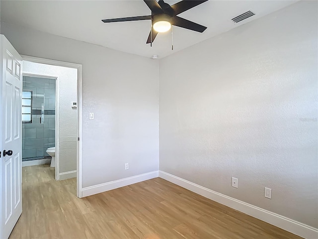 4202 W Bay Vista Ave, Tampa, FL 33611 - spare room with light wood-style flooring and a ceiling fan
