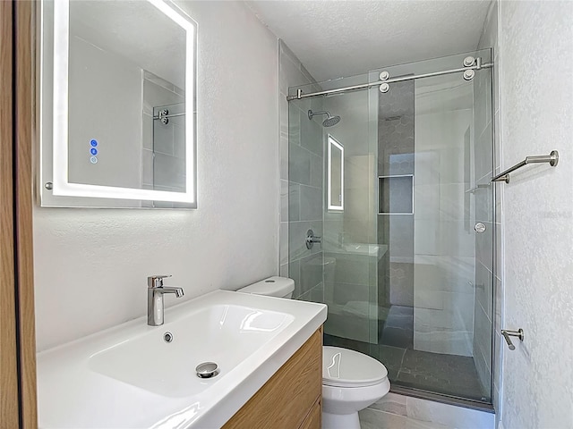 4202 W Bay Vista Ave, Tampa, FL 33611 - bathroom with a textured wall, a shower stall, and vanity