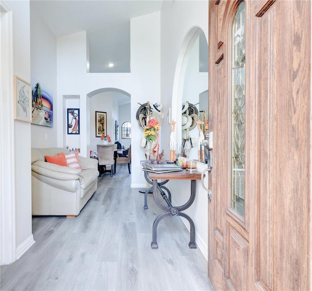 1014 Prey Ct, Kissimmee, FL 34746 - entrance foyer with arched walkways and wood finished floors