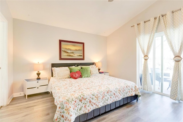 1014 Prey Ct, Kissimmee, FL 34746 - bedroom with light wood finished floors, access to outside, and lofted ceiling