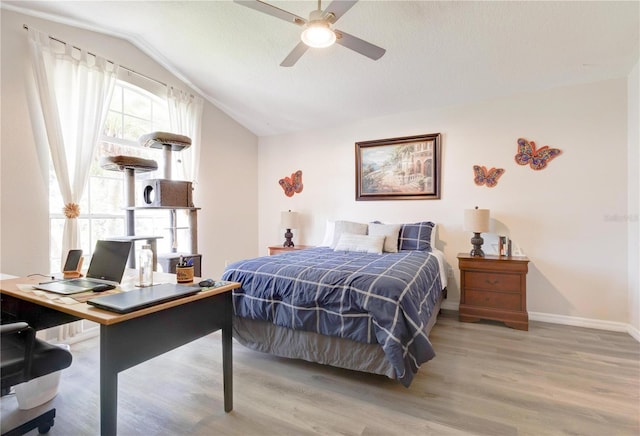 1014 Prey Ct, Kissimmee, FL 34746 - bedroom featuring vaulted ceiling, wood finished floors, an office area, and ceiling fan