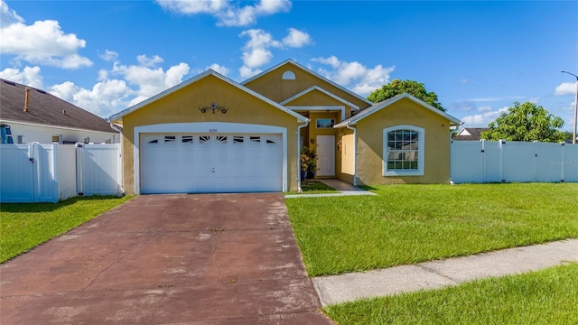 5100 Violet Ln, Kissimmee, FL 34758 - view of front of property featuring a gate, concrete driveway, an attached garage, and stucco siding