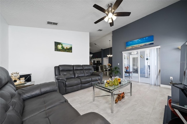 5100 Violet Ln, Kissimmee, FL 34758 - living area with a ceiling fan, a chandelier, vaulted ceiling, and a textured ceiling