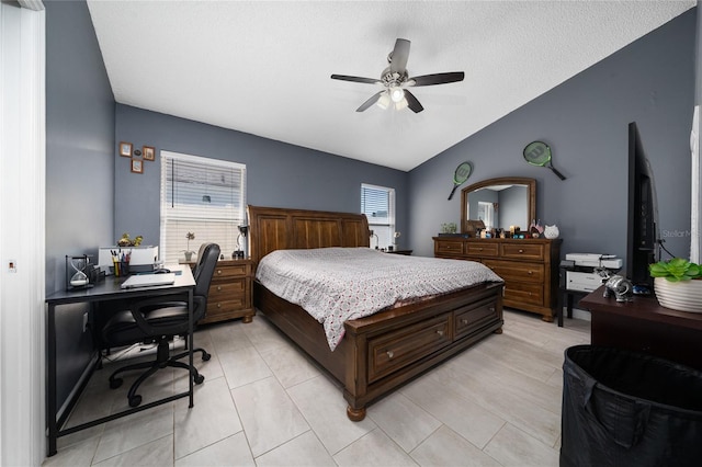 5100 Violet Ln, Kissimmee, FL 34758 - bedroom with a desk, lofted ceiling, light tile patterned floors, ceiling fan, and a textured ceiling