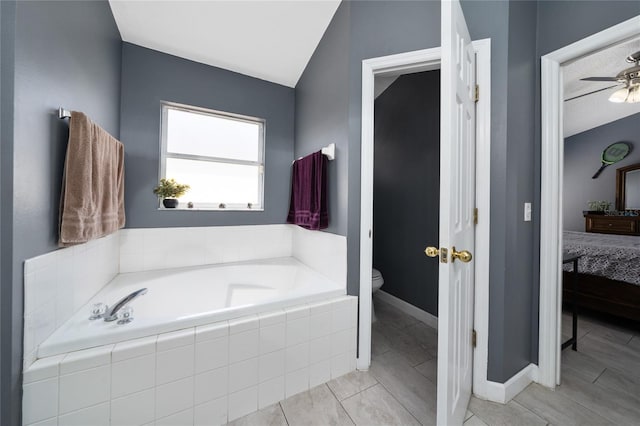 5100 Violet Ln, Kissimmee, FL 34758 - ensuite bathroom featuring a garden tub, a ceiling fan, and lofted ceiling