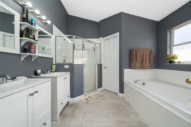 5100 Violet Ln, Kissimmee, FL 34758 - full bath with a stall shower, two vanities, a bath, and tile patterned floors