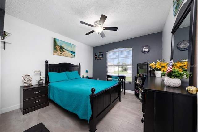 5100 Violet Ln, Kissimmee, FL 34758 - bedroom with a textured ceiling and ceiling fan