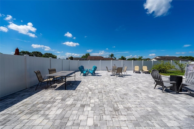 5100 Violet Ln, Kissimmee, FL 34758 - fenced backyard with outdoor dining area and a patio