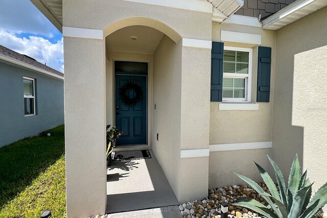 2727 Harmonia Hammock Rd, Harmony, FL 34773 - view of exterior entry featuring stucco siding