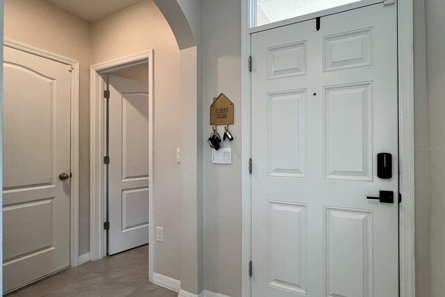 2727 Harmonia Hammock Rd, Harmony, FL 34773 - hall with arched walkways and baseboards