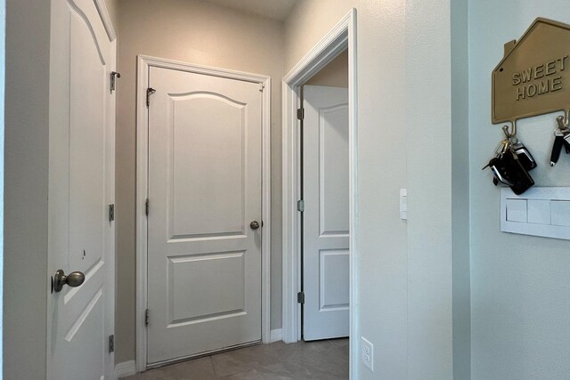 2727 Harmonia Hammock Rd, Harmony, FL 34773 - corridor with tile patterned floors