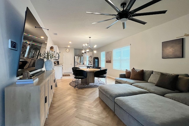 2727 Harmonia Hammock Rd, Harmony, FL 34773 - living room with a chandelier, ceiling fan, and recessed lighting