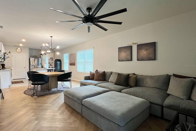 2727 Harmonia Hammock Rd, Harmony, FL 34773 - living room featuring a chandelier, ceiling fan, and recessed lighting