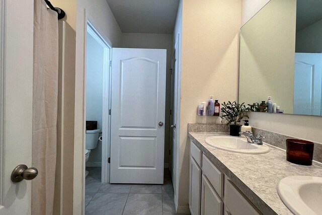 2727 Harmonia Hammock Rd, Harmony, FL 34773 - bathroom featuring double vanity and tile patterned flooring