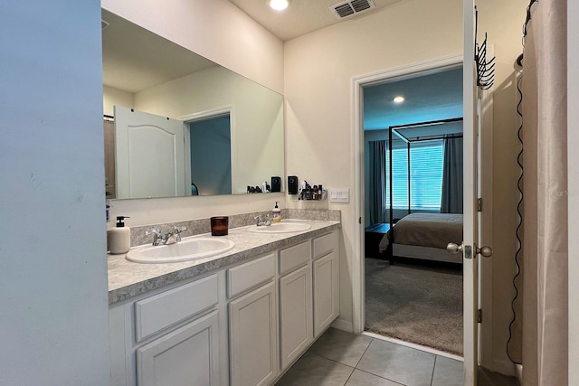 2727 Harmonia Hammock Rd, Harmony, FL 34773 - full bath with tile patterned floors, ensuite bath, double vanity, and recessed lighting