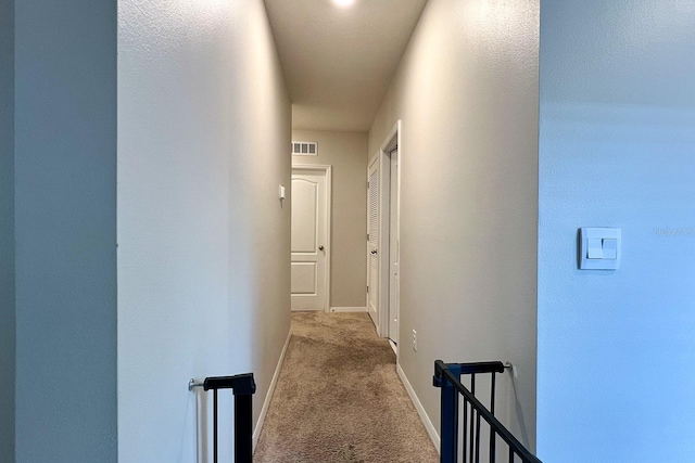 2727 Harmonia Hammock Rd, Harmony, FL 34773 - hall with an upstairs landing and carpet