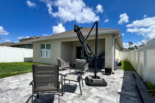 2727 Harmonia Hammock Rd, Harmony, FL 34773 - fenced backyard featuring a patio area and outdoor lounge area