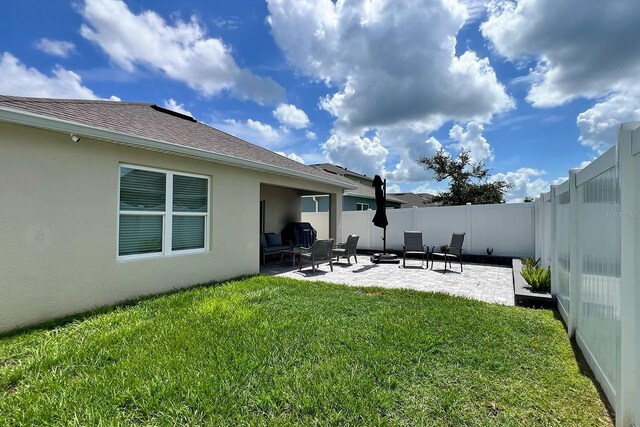 2727 Harmonia Hammock Rd, Harmony, FL 34773 - fenced backyard featuring a patio