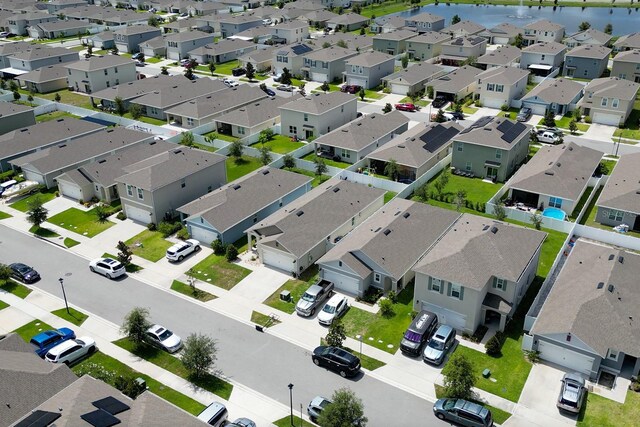 2727 Harmonia Hammock Rd, Harmony, FL 34773 - aerial view of residential area with a large body of water