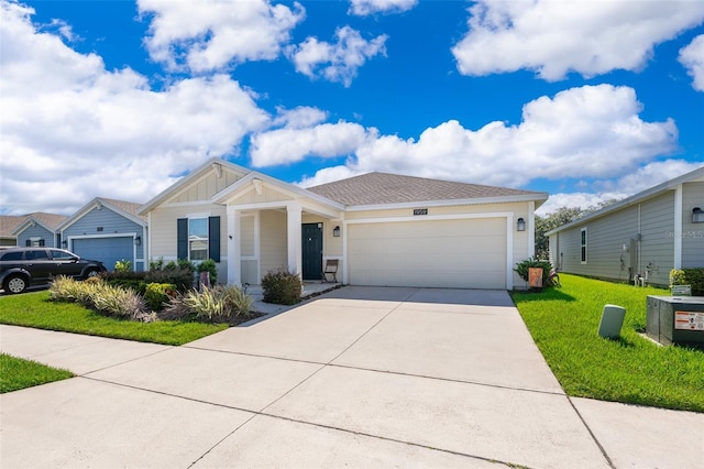 1959 Cricket Cradle Dr, Kissimmee, FL 34746 - ranch-style house featuring a garage, driveway, a front yard, and board and batten siding