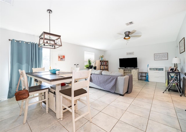 1959 Cricket Cradle Dr, Kissimmee, FL 34746 - dining space with light tile patterned flooring, ceiling fan, and a chandelier