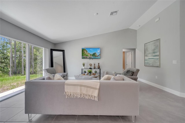 33 Peterlee Ct, Kissimmee, FL 34758 - living area with lofted ceiling and tile patterned floors
