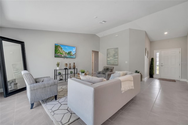 33 Peterlee Ct, Kissimmee, FL 34758 - living area featuring vaulted ceiling, light tile patterned floors, and recessed lighting