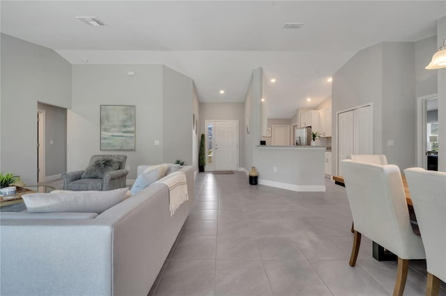 33 Peterlee Ct, Kissimmee, FL 34758 - living room with light tile patterned flooring and high vaulted ceiling