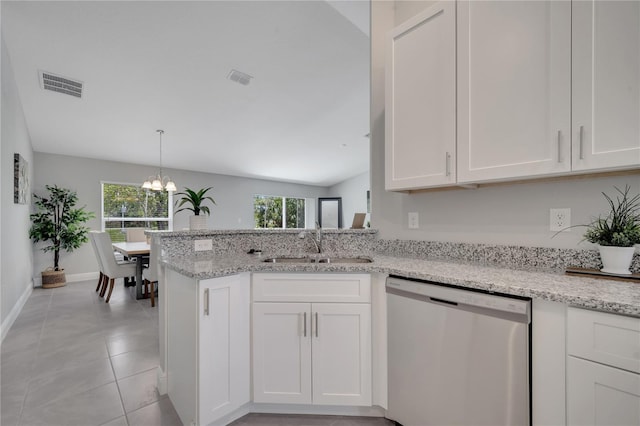 33 Peterlee Ct, Kissimmee, FL 34758 - kitchen with dishwasher, white cabinets, a chandelier, and light stone counters