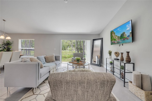 33 Peterlee Ct, Kissimmee, FL 34758 - living area featuring a chandelier and lofted ceiling