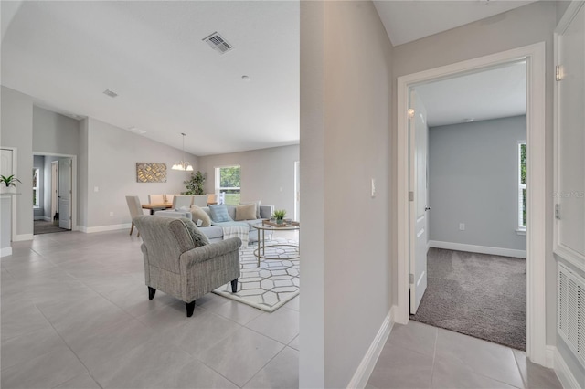 33 Peterlee Ct, Kissimmee, FL 34758 - living area featuring vaulted ceiling and light tile patterned flooring