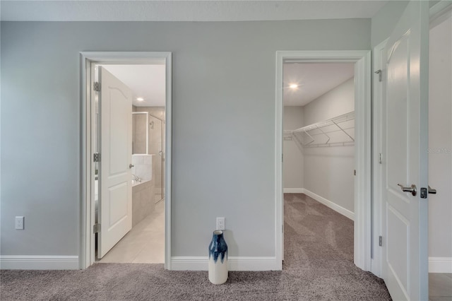 33 Peterlee Ct, Kissimmee, FL 34758 - unfurnished bedroom with light carpet, a walk in closet, and ensuite bath