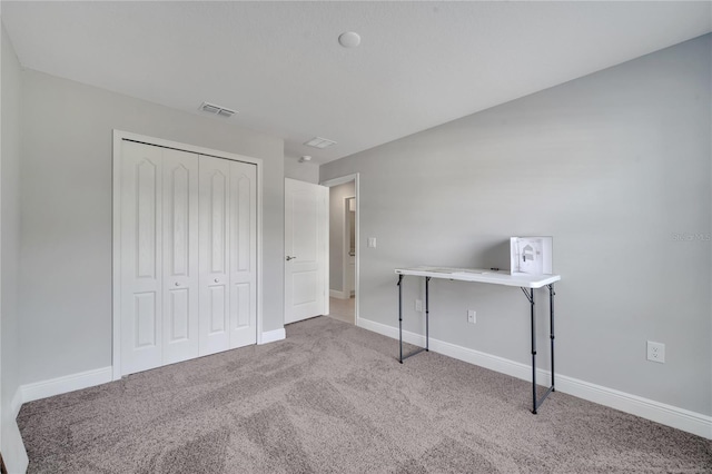 33 Peterlee Ct, Kissimmee, FL 34758 - unfurnished bedroom featuring carpet floors and a closet