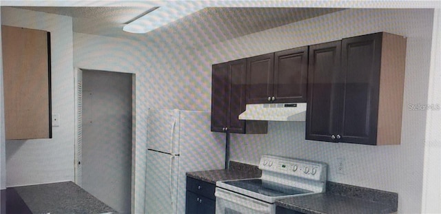 2002 Cascades Blvd Unit 108, Kissimmee, FL 34741 - kitchen featuring white appliances, exhaust hood, dark countertops, and dark brown cabinets