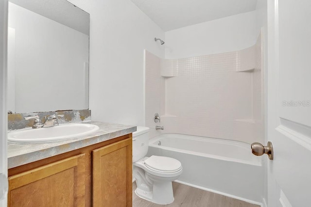 303 Anchovie Ct, Poinciana, FL 34759 - full bath featuring vanity, wood finished floors, and shower / bath combination