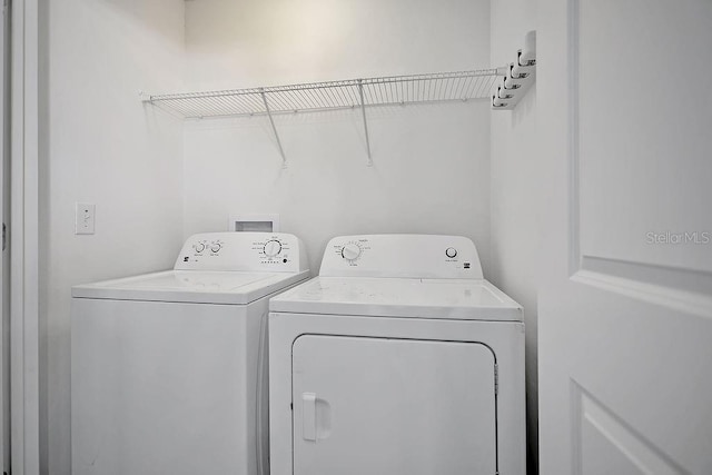 303 Anchovie Ct, Poinciana, FL 34759 - laundry room with washer and clothes dryer