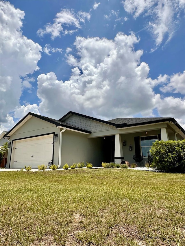144 Foxtail Loop, Davenport, FL 33837 - single story home featuring stucco siding, an attached garage, a front lawn, and concrete driveway