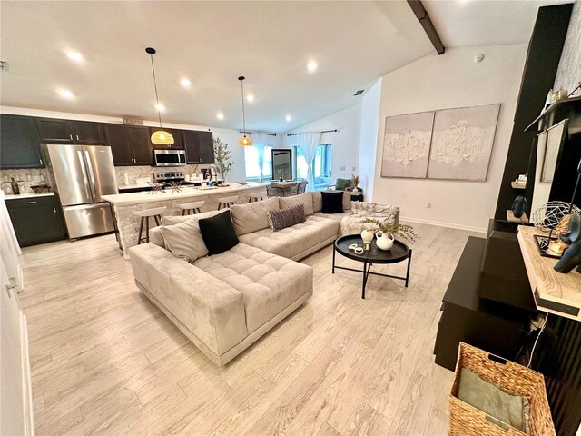 144 Foxtail Loop, Davenport, FL 33837 - living area with light wood-style floors and recessed lighting