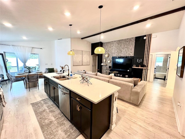 144 Foxtail Loop, Davenport, FL 33837 - kitchen with open floor plan, stainless steel dishwasher, light wood-type flooring, light countertops, and recessed lighting