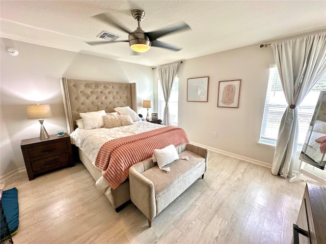 144 Foxtail Loop, Davenport, FL 33837 - bedroom featuring light wood-type flooring and a ceiling fan