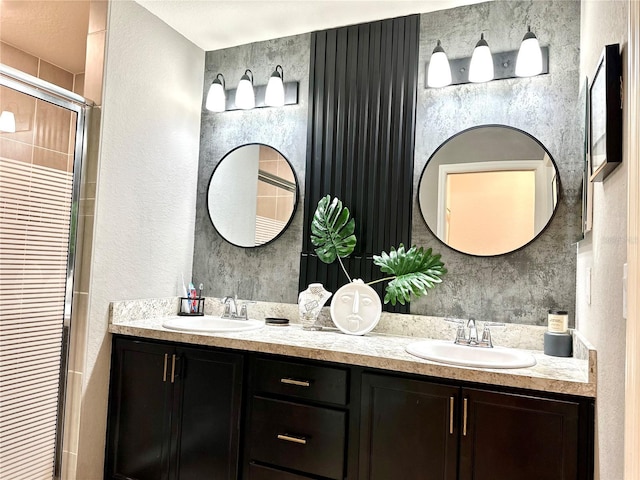 144 Foxtail Loop, Davenport, FL 33837 - bathroom with double vanity, tiled shower, and a textured wall