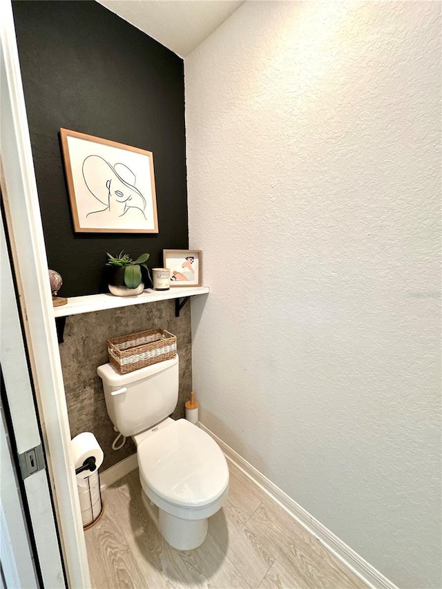 144 Foxtail Loop, Davenport, FL 33837 - bathroom featuring toilet and baseboards